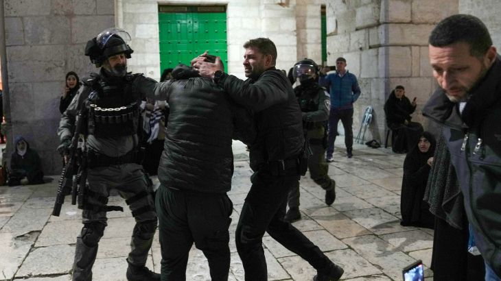 Israeli police detain a Palestinian worshipper at the Al-Aqsa Mosque compound in the Old City of Jerusalem during the Muslim holy month of Ramadan, Wednesday, April 5, 2023. Palestinian media reported police attacked Palestinian worshippers, raising fears of wider tension as Islamic and Jewish holidays overlap.(AP Photo/Mahmoud Illean)