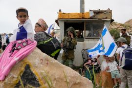 Hardline ultranationalist Jewish settlers march to the unauthorized settlement outpost Eviatar in the northern West Bank