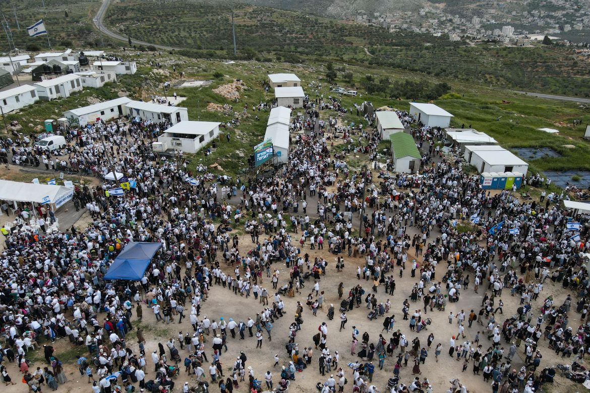 Israeli settlers gather in the outpost of Eviatar