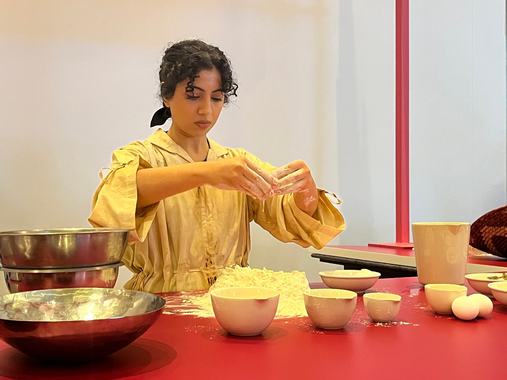 Almatrooshi during her performance The Alphabetics of the Baker at Art Dubai. Photo by Maghie Ghali