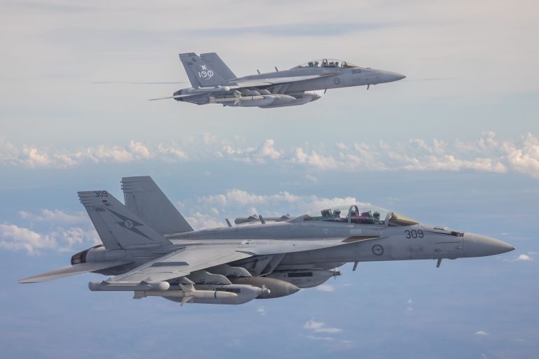 Two Royal Australian Air Force EA-18G Growlers fly together over Australia's Northern Territory.