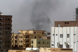 Smoke rises above buildings in Khartoum on April 15, 2023, amid reported clashes in the city. - The Sudanese army said on April 15 that paramilitaries attacked its bases in Khartoum and elsewhere, shortly after the paramilitary said their camps were attacked by the regular army. (Photo by - / AFP)