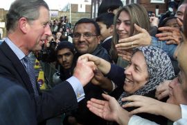 Britain's Prince Charles, the Prince of Wales, meets members of the public outside the Suleymaniye Mosque, a Turkish Islamic cultural centre, in Hackney, East London, September 28, 2001. He was showing his support for British Muslims.
