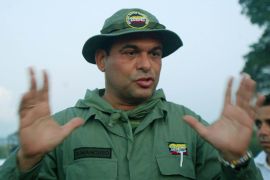 Salvatore Mancuso, the top commander of far-right Colombian paramilitaries, talks to the media in Campo Dos, Colombia, on December 9, 2004
