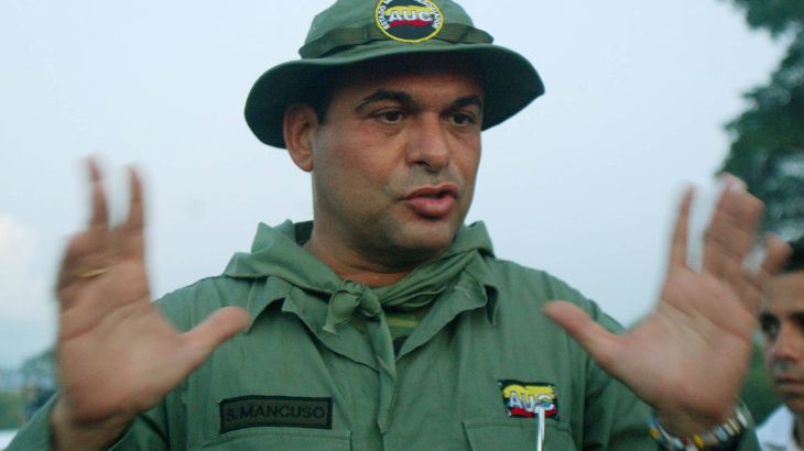 Salvatore Mancuso, the top commander of far-right Colombian paramilitaries, talks to the media in Campo Dos, Colombia, on December 9, 2004