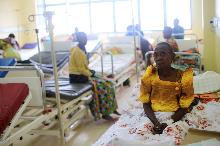 A patient rests on a bed in a hospital in Kampala, Uganda