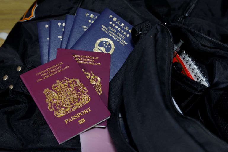 British National Overseas passports (BNO) and Hong Kong Special Administrative Region of the People's Republic of China passports sit on top of a family's baggage before they emigrate to Scotland, at a home in Hong Kong, China, December 17, 2020.