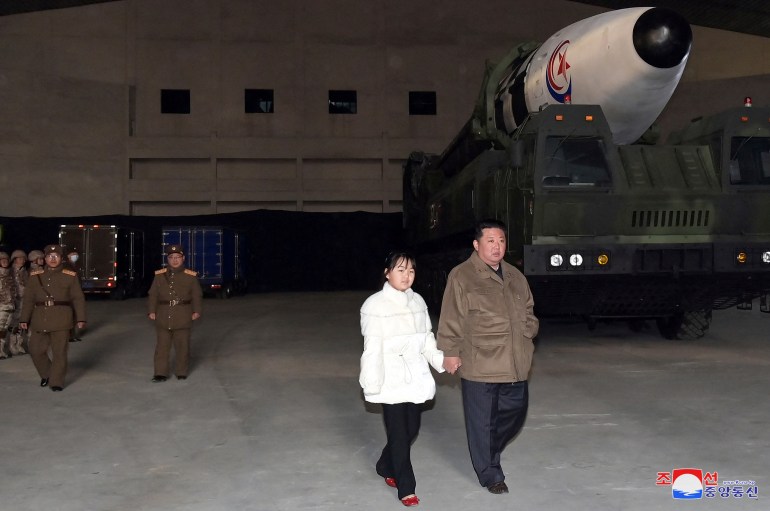 North Korean leader Kim Jong Un, along with his daughter, inspects an intercontinental ballistic missile (ICBM) in this undated photo released on November 19, 2022 by North Korea's Korean Central News Agency (KCNA). KCNA via REUTERS ATTENTION EDITORS - THIS IMAGE WAS PROVIDED BY A THIRD PARTY. NO THIRD PARTY SALES. SOUTH KOREA OUT. NO COMMERCIAL OR EDITORIAL SALES IN SOUTH KOREA. REUTERS IS UNABLE TO INDEPENDENTLY VERIFY THIS IMAGE.