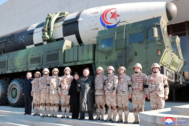 North Korean leader Kim Jong Un and his daughter attend a photo session with the scientists, engineers, military officials and others involved in the test-fire of the country's new Hwasong-17 intercontinental ballistic missile (ICBM) in this undated photo released on November 27, 2022 by North Korea's Korean Central News Agency (KCNA) KCNA via REUTERS ATTENTION EDITORS - THIS IMAGE WAS PROVIDED BY A THIRD PARTY. REUTERS IS UNABLE TO INDEPENDENTLY VERIFY THIS IMAGE. NO THIRD PARTY SALES. SOUTH KOREA OUT. NO COMMERCIAL OR EDITORIAL SALES IN SOUTH KOREA.