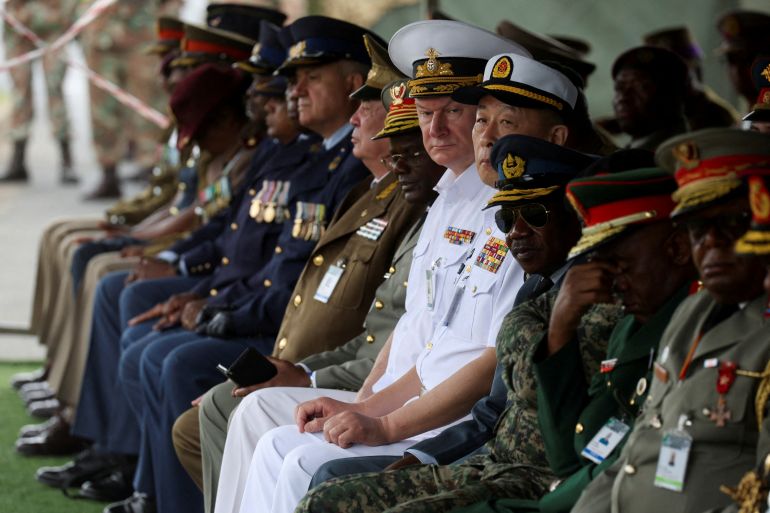 Foreign military officials look on during an Armed Forces Day parade ahead of scheduled naval exercises with Russian and Chinese navies in Richards Bay, South Africa, February 21, 2023.