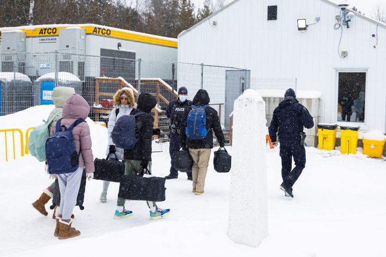 Asylum seekers cross into Canada from the U.S. border on Roxham Road in Champlain, New York, U.S., February 25, 2023