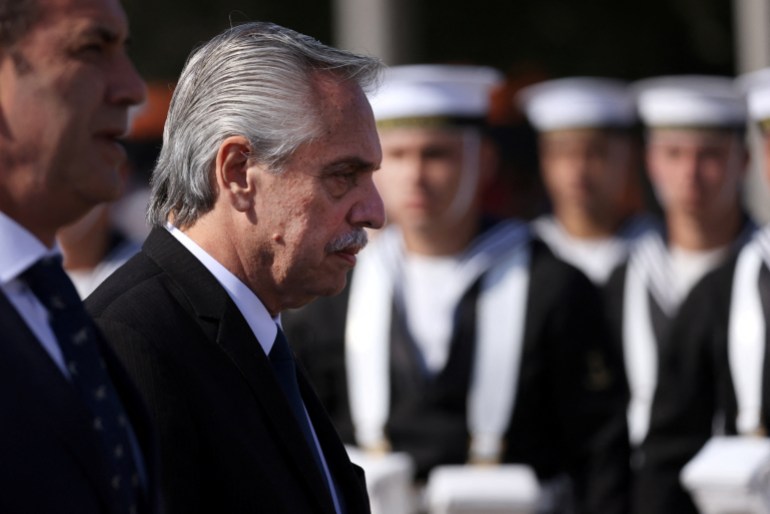 Argentina's President Alberto Fernandez walks past a honor guard during an official ceremony while meeting with Chile's President Gabriel Boric in Santiago, Chile, April 5, 2023.