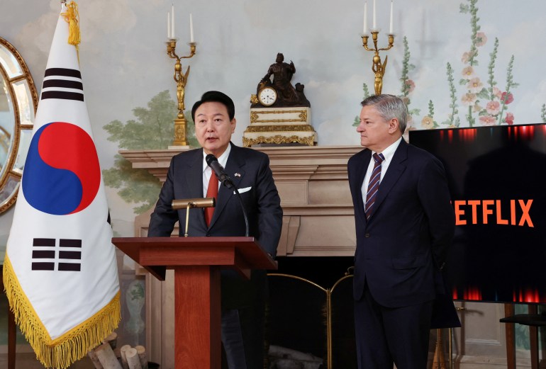 South Korean President Yoon Suk-yeol speaks next to Netflix co-CEO Ted Sarandos during a news conference in Washington, DC, the US.