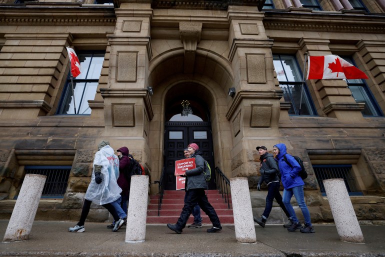 Striking Canadian federal workers outside PM Justin Trudeau's office in Ottawa