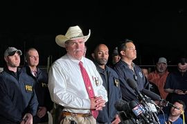 San Jacinto County Sheriff Greg Capers, centre, announces the arrest of Francisco Oropesa who is suspected of killing five neighbours in Cleveland, Texas