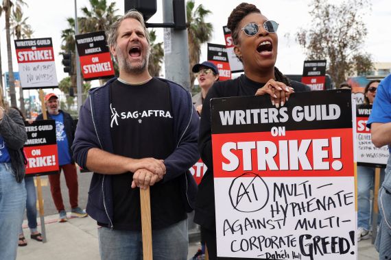 Writers Guild of America members and supporters chant slogans during a picket outside Sunset Bronson Studios and Netflix Studios, after union negotiators called a strike for film and television writers, in Los Angeles, California, U.S., May 3, 2023