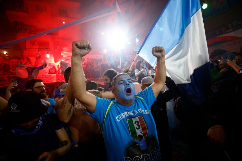 Napoli fans celebrate winning Serie A.