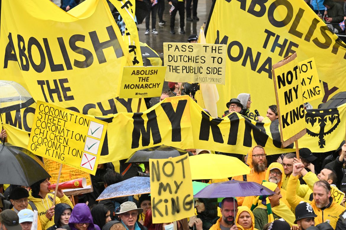 Protesters wave 'Not My King' signs near to the 'King's Procession', a journey of 2km (1.2 miles) from Buckingham Palace to Westminster Abbey in central London ahead of the coronations.