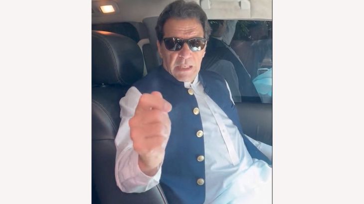 Former Pakistan Prime Minister Imran Khan gestures in a video statement, at an unknown location in Pakistan