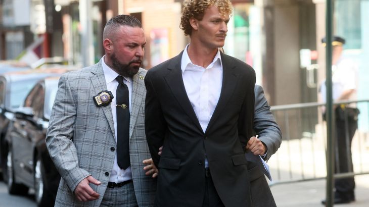 Former U.S. Marine Daniel Penny is escorted from a New York City police station to face manslaughter charges
