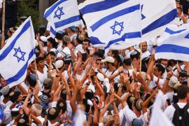 Israelis sing and dance with flags by Damascus gate
