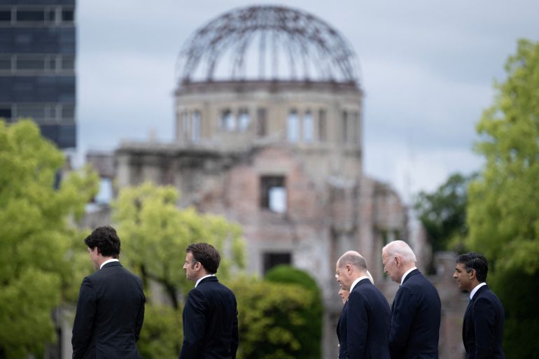 Canada's Prime Minister Justin Trudeau, France's President Emmanuel Macron, Germany's Chancellor Olaf Scholz, European Commission President Ursula von der Leyen, US President Joe Biden and Britain's Prime Minister Rishi Sunak walk before the Atomic Bomb Dome during a visit to the Peace Memorial Park as part of the G7 Leaders' Summit in Hiroshima on May 19, 2023. BRENDAN SMIALOWSKI/Pool via REUTERS
