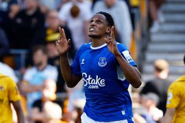 Everton's Yerry Mina looks and points up to the sky as he celebrates scoring a goal