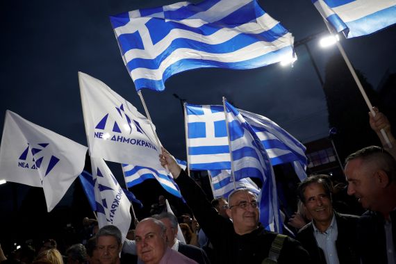 Supporters of New Democracy conservative party react at the party's headquarters after the announcement of the first exit polls, in Athens, Greece, May 21, 2023.