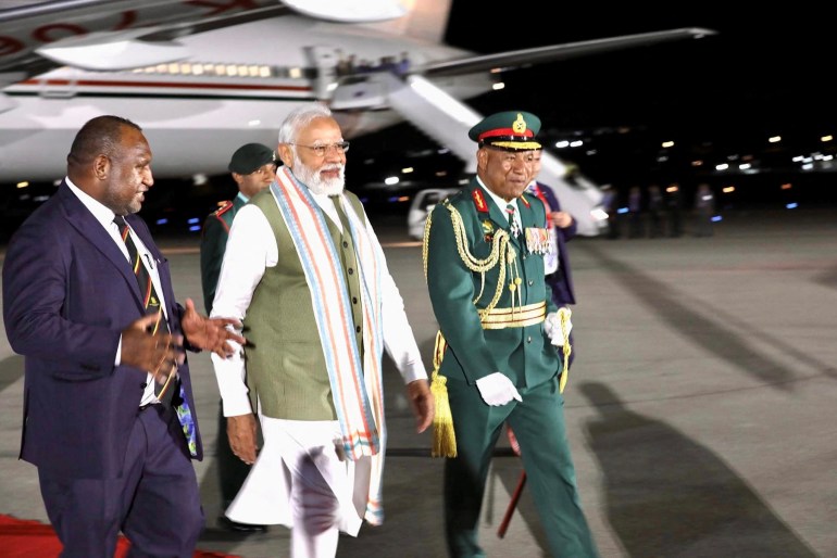 Indian PM Narendra Modi arriving at PNG airport and being greeted by Prime Minister James Marape.