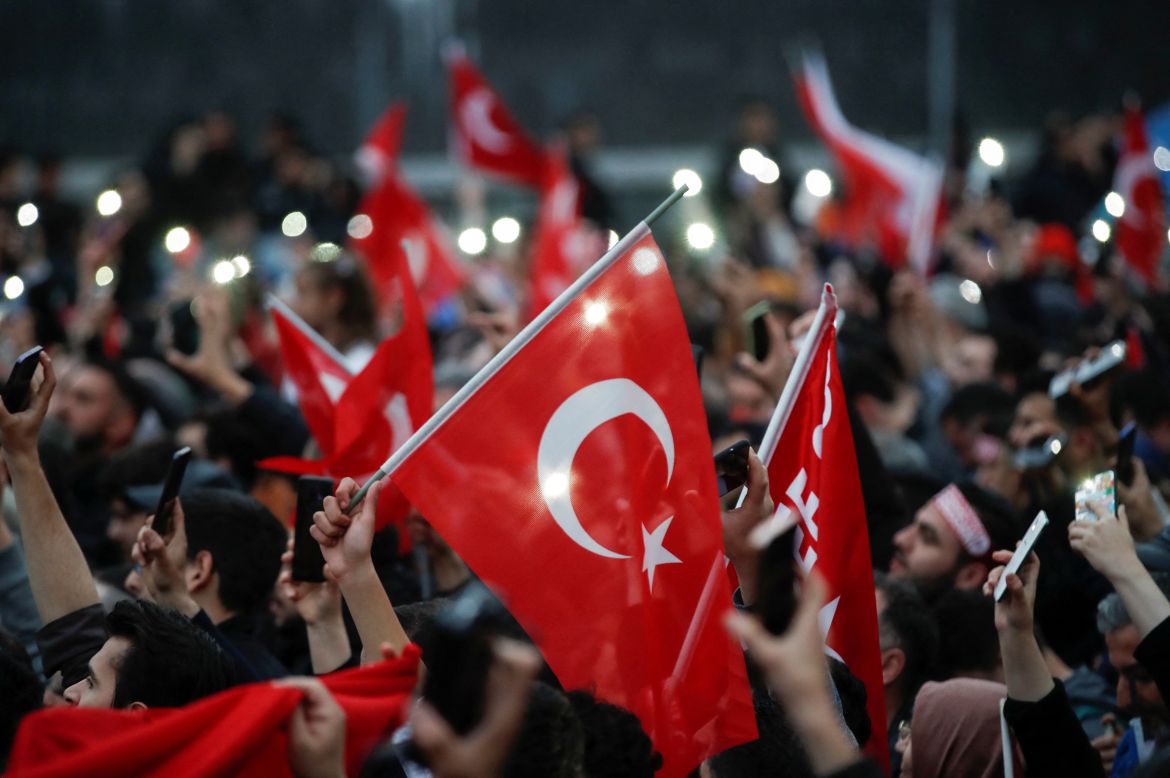 Supporters of Turkish President Tayyip Erdogan wait for his address