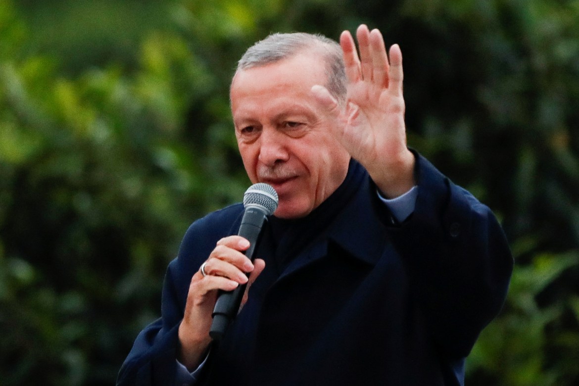 Turkish President Tayyip Erdogan addresses his supporters following early exit poll results