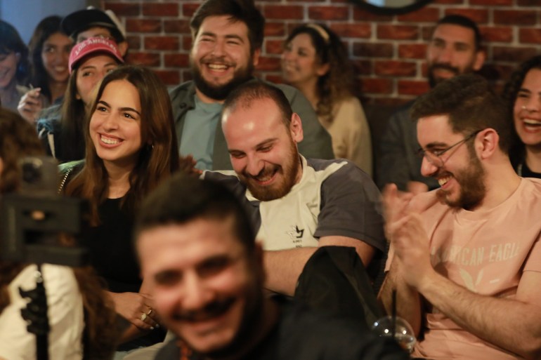 People attend a comedy night titled "Styria" which is an Arabic mash-up of Syria and hysteria, in Damascus