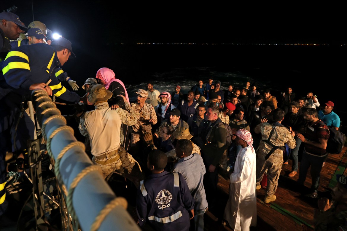 Saudi naval and special forces hoist evacuees aboard a vessel during a rescue operation from Port Sudan to Jeddah