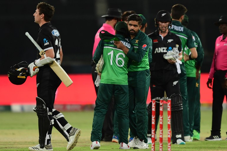 Pakistan's captain Babar Azam and teammates celebrate after winning cricket match against New Zealand.