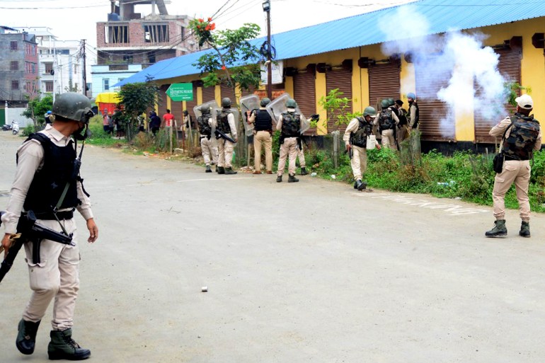 In this picture taken on May 4, 2023, security personnel fire tear gas in Imphal.