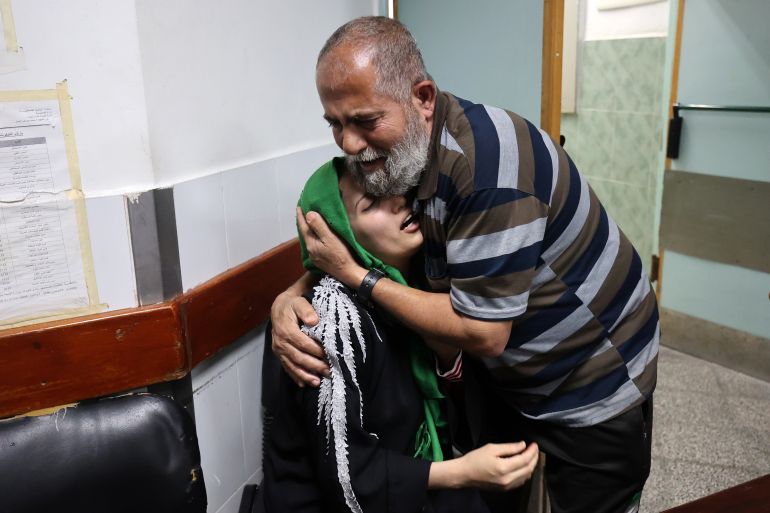 Relatives of Palestinian Islamic Jihad leader Jihad Ghannam, killed by an Israeli airstrike at his home, mourn at Alnajjar hospital in Rafah refugee camp