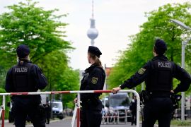 Police officers man a barrricade near the Chancellery