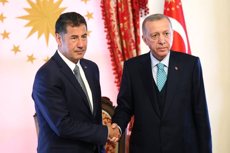 This handout photograph taken and released on May 19, 2023 shows Turkish President Recep Tayyip Erdogan (R) meeting the former presidential candidate of the ATA Alliance Sinan Ogan at Dolmabahce Office in Istanbul.