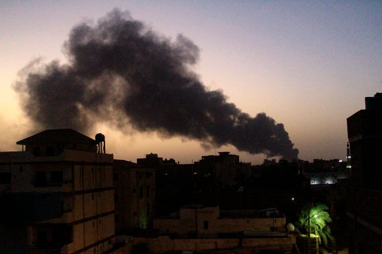 Smoke rises above buildings in southern Khartoum
