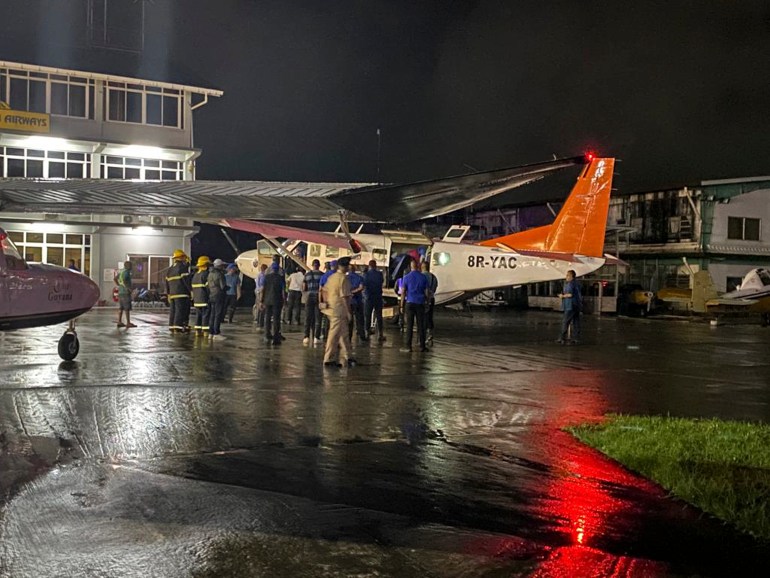 plane and medical personnel in Guyana evacuating injured students