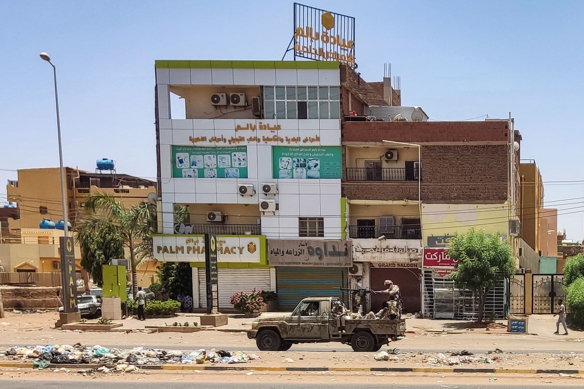 A vehicle of the paramilitary Rapid Support Forces drives down al-Sittin (sixty) road in Khartoum