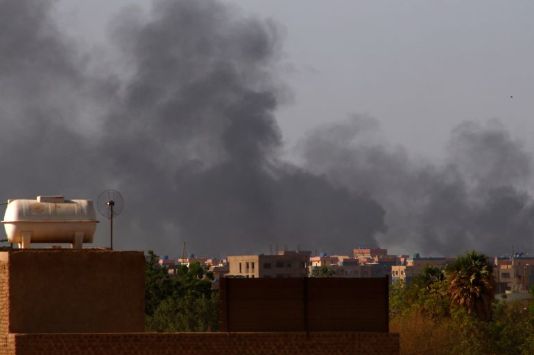 Smoke billows in the distance in Khartoum