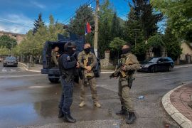 A Kosovan police special unit secures an intersection in the town of Zvecan