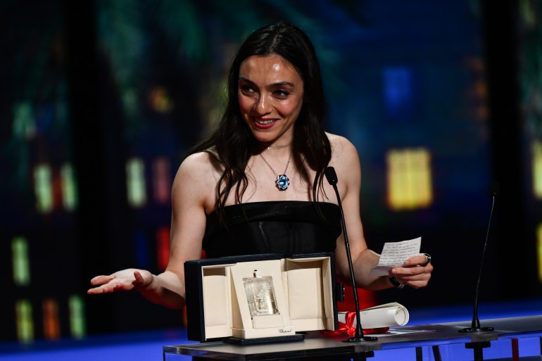 Turkish actress Merv Dizdain speaks on stage after winning Best Actress for the film "Kuru Otla Ustun" (About Hay) at the closing ceremony of the 76th Cannes Film Festival in Cannes, South of France on May 27, 2023.  (Photo: CHRISTOPHE SIMON/AFP)
