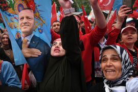 Supporters of Turkish President Tayyip Erdogan celebrate as the president declared victory in the country's presidential elections