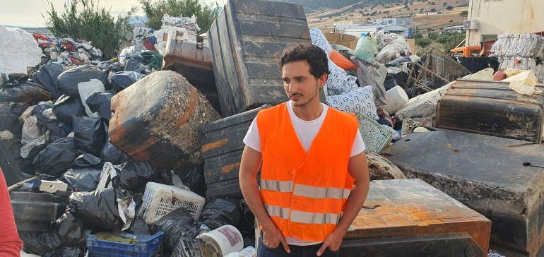 Lefteris Arapakis stands in front of Enaleia’s plastic catch of the day, in the Skyplast marshalling yard