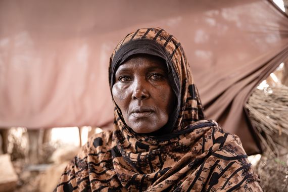 “We came to this village, and it was full of displaced people. You hear the sound of shelling, you leave everything behind and run,” says Asha Awad Jama, a shop owner displaced from Las Anod.