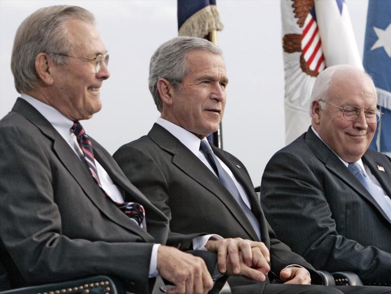 The former US Secretary of Defense Donald Rumsfeld, US President George W Bush, and Vice President Richard Cheney at the farewell honour ceremony at the Pentagon for Rumsfeld in 2006.
