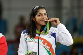 India&#39;s Sakshi Malik poses with her bronze medal for the women&#39;s wrestling freestyle 58-kg competition at the 2016 Summer Olympics in Rio de Janeiro, Brazil [File: Markus Schreiber/AP]