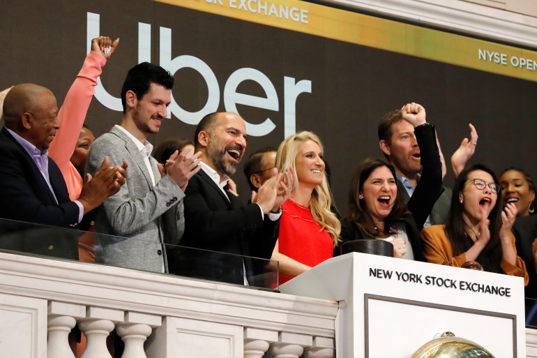 Uber CEO Dara Khosrowshahi, third from left, attends the opening bell ceremony at the New York Stock Exchange, as his company makes its initial public offering